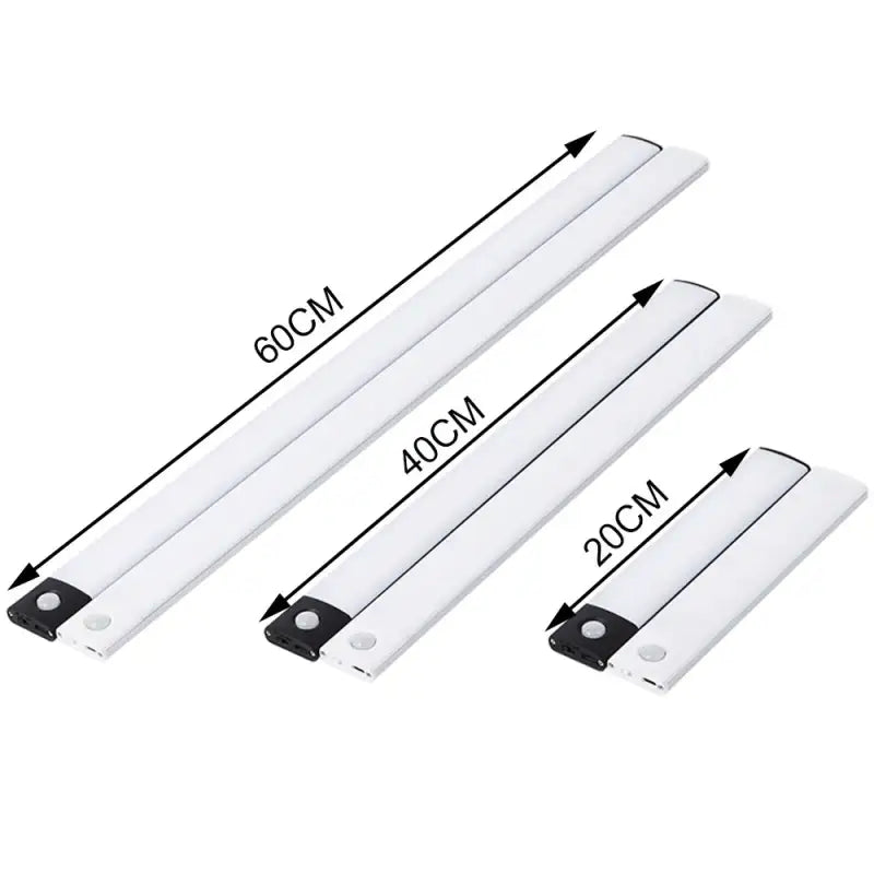three white plastic blades with black handles and a white background