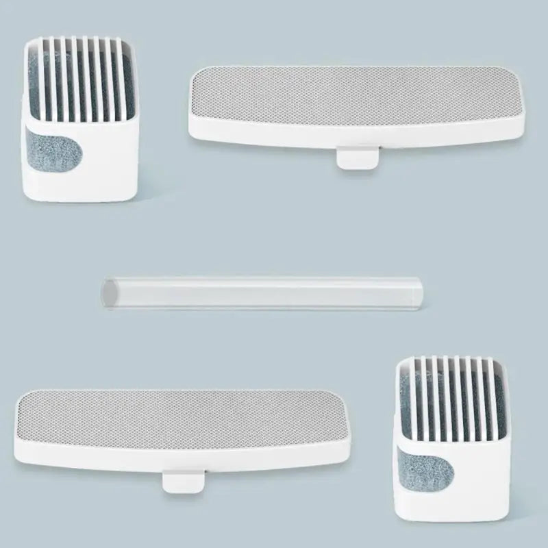 three white plastic hair brushes on a blue background