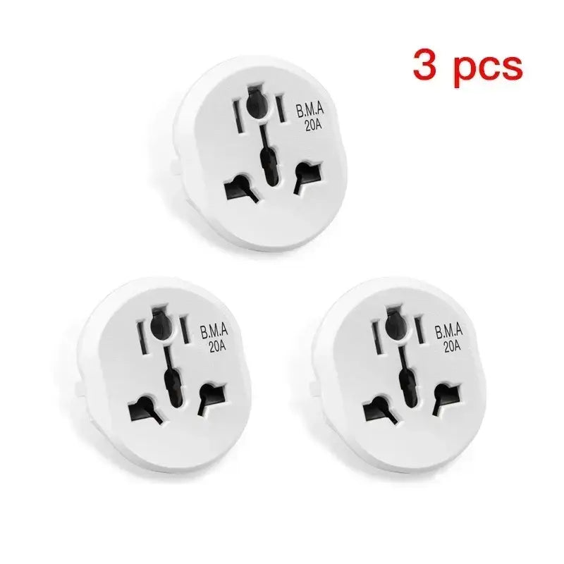 three white plugs with black numbers on them on a white background