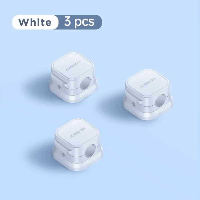 three white wireless devices on a blue background
