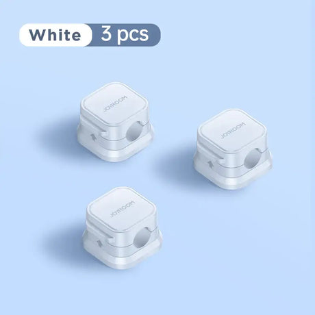 Three white wireless devices on a blue background