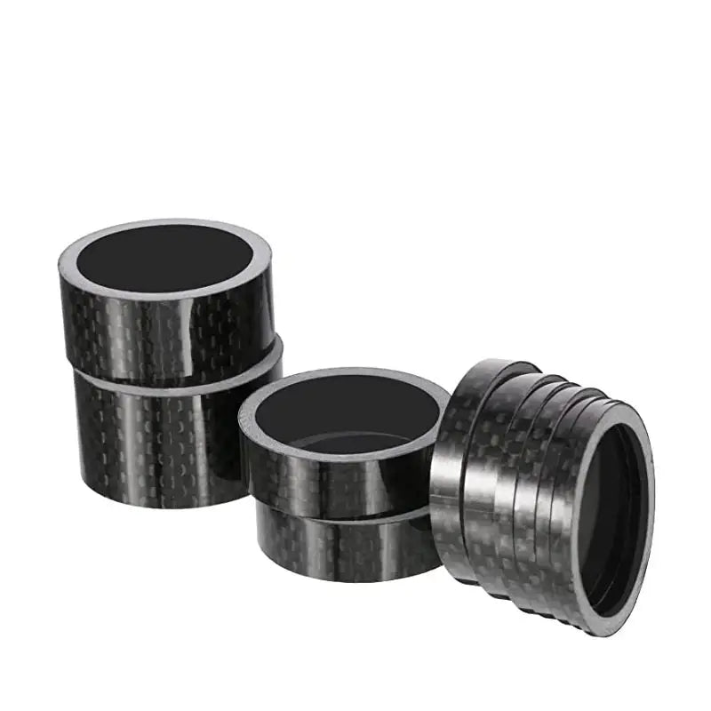 a pair of black carbon carbon pipe fittings