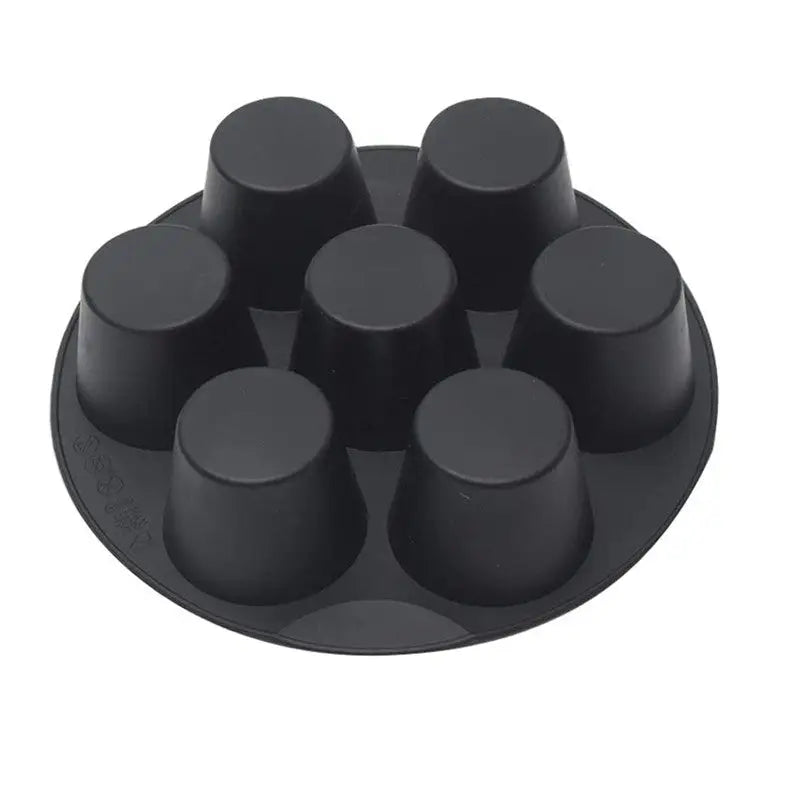 a close up of a black plastic cake pan with six black knobs