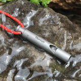 a flashlight on a rock with water in the background