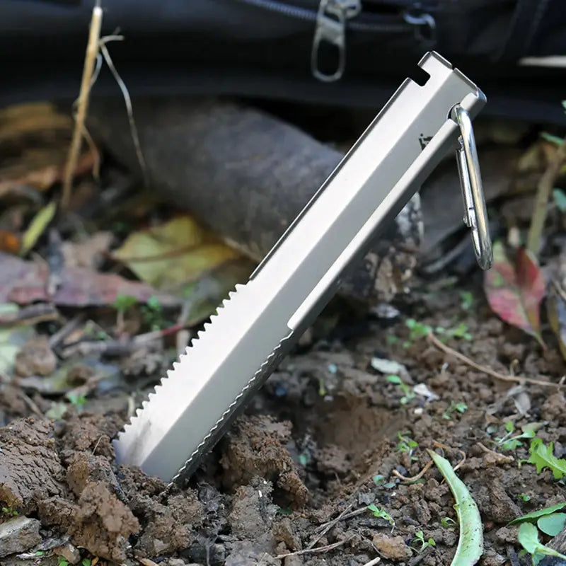 a knife is stuck into the ground