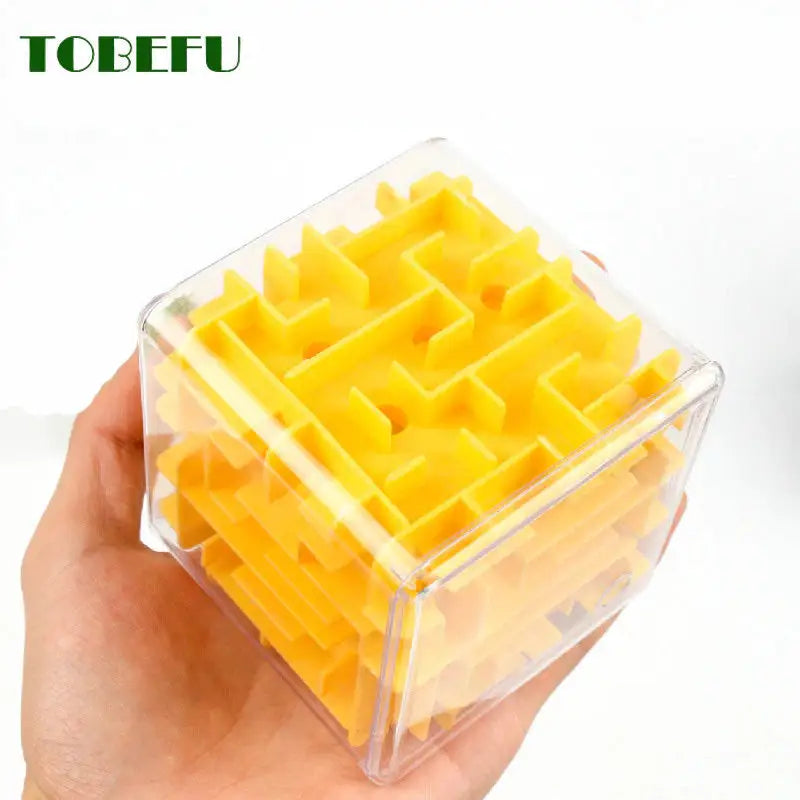 a hand holding a plastic container filled with yellow cubes