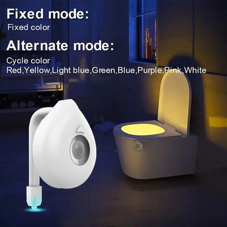 A toilet with a light on it and a toilet bowl