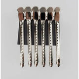 a set of five silver and black hair brushes