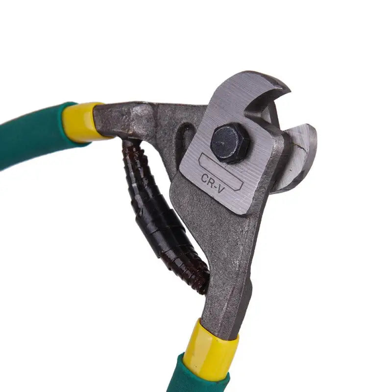 a close up of a pair of pliers with a green handle