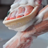 a person washing their hands with soap