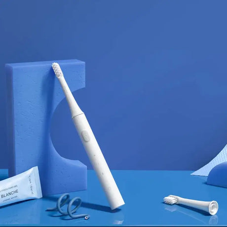 A toothbrush and toothbrush on a blue background