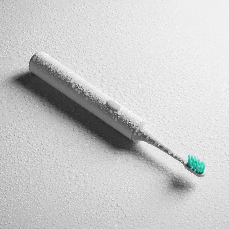 a toothbrush with water droplets on it