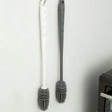 a toothbrush and toothbrush on a white surface