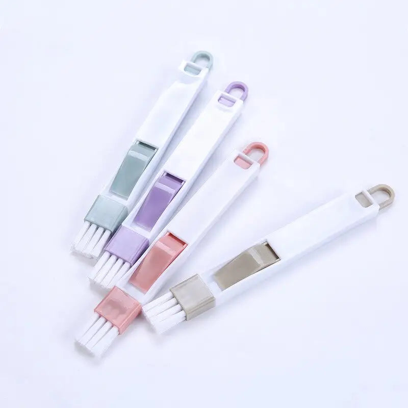 several toothbrushes are lined up on a white surface