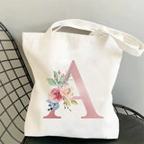 a tote bag with a floral mono