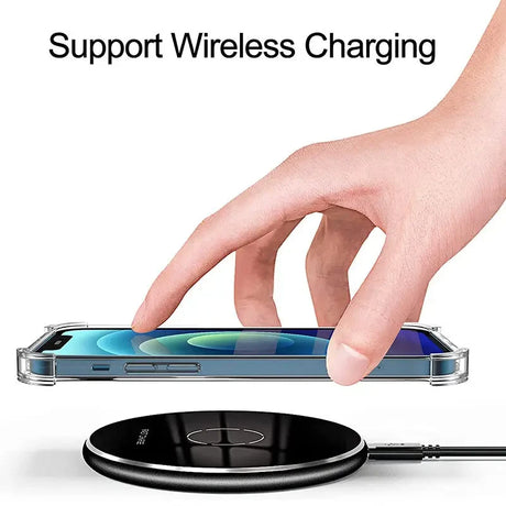 a hand is touching a wireless charger