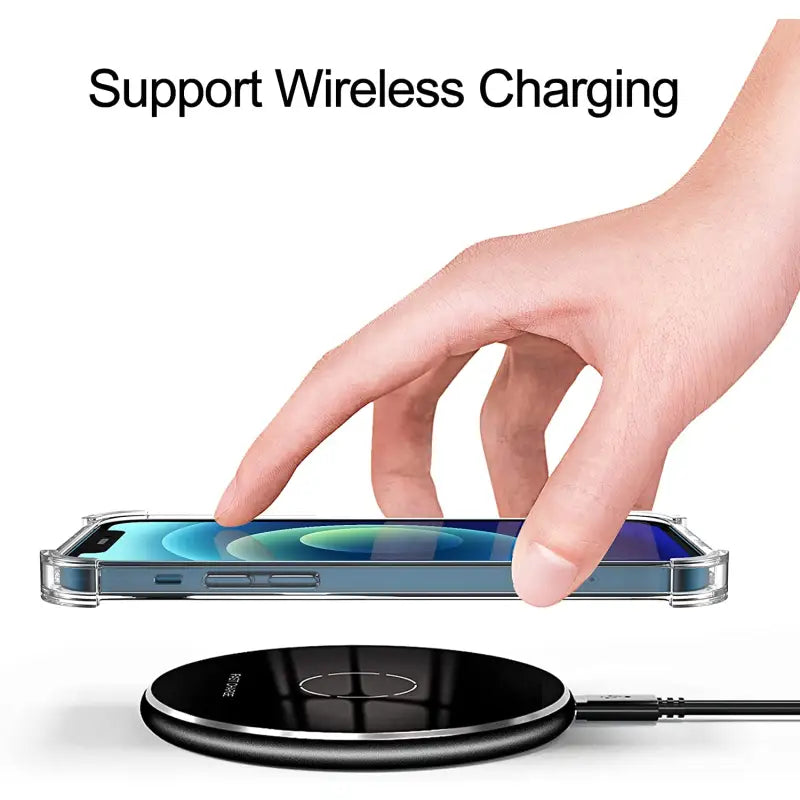 a hand holding a wireless phone charger