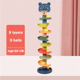 a toy tower with a bear on top