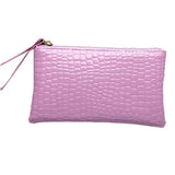 a pink crocodile skin leather clutch bag