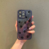 Back side of a translucent purple samsung galaxy phone case with black paw print decals and subtle brand logo