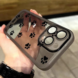 Transparent gray Samsung Galaxy phone case with black paw print decals shown from the back side