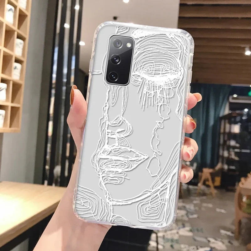 Transparent phone case with delicate white line art of a woman’s face showing abstract art design on the back for Samsung Galaxy