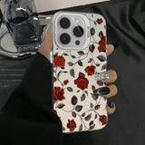 Back side of a transparent retro matte phone case for samsung galaxy with red rose and black vine design and silver camera cutout