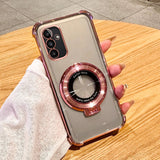 Transparent smartphone case with a rose gold circular ring feature and reinforced corners.