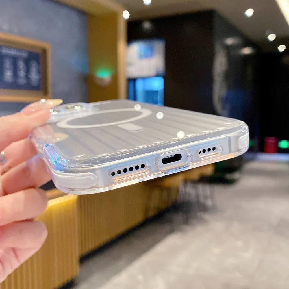 A transparent smartphone case with a visible MagSafe ring and precise cutouts for speakers and charging port.