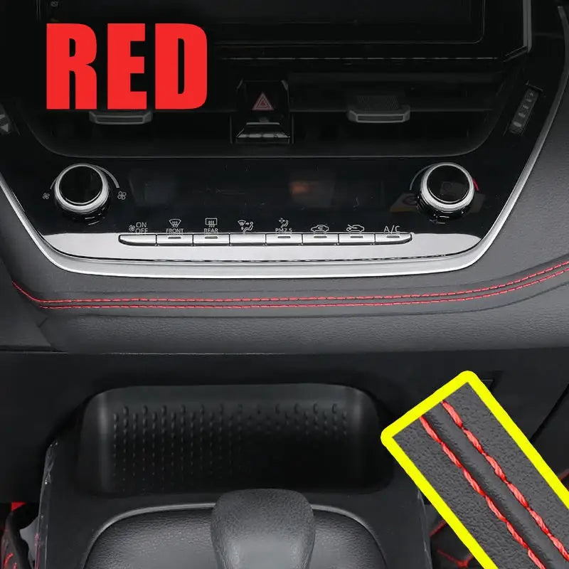 the interior of a car with red and black trims