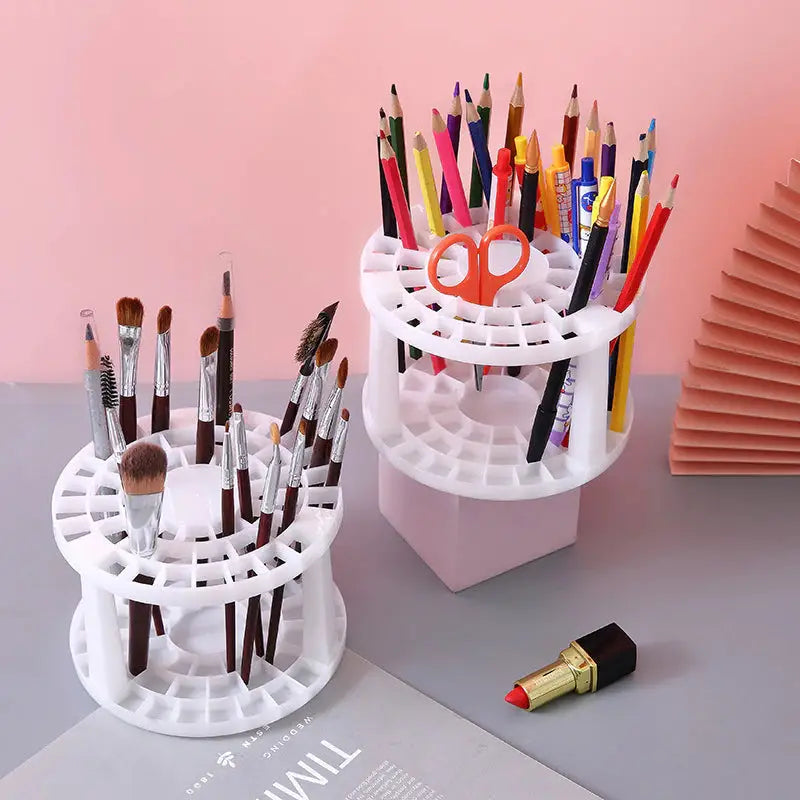 a white desk organizer with a pen holder and a pencil holder