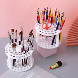 a white desk organizer with a pen holder and a pencil holder