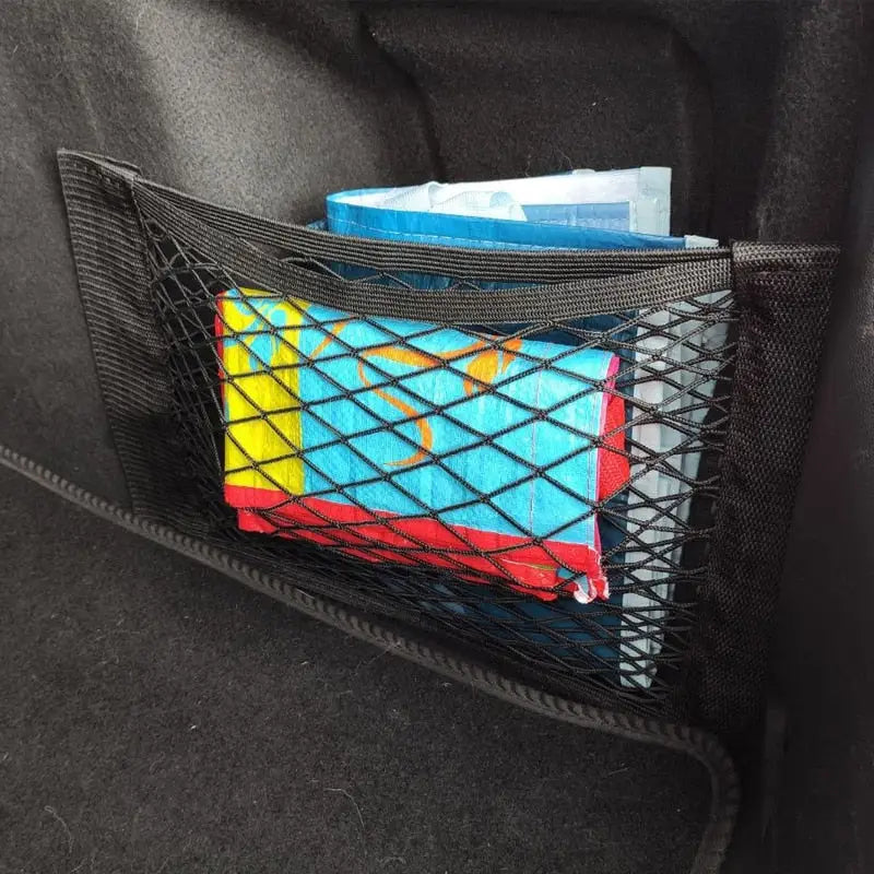 a car trunk with a basket filled with books