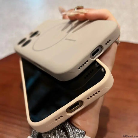 Two beige silicone phone cases, one with a subtle circular design and the other plain.