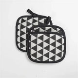 two black and white triangles pot holders