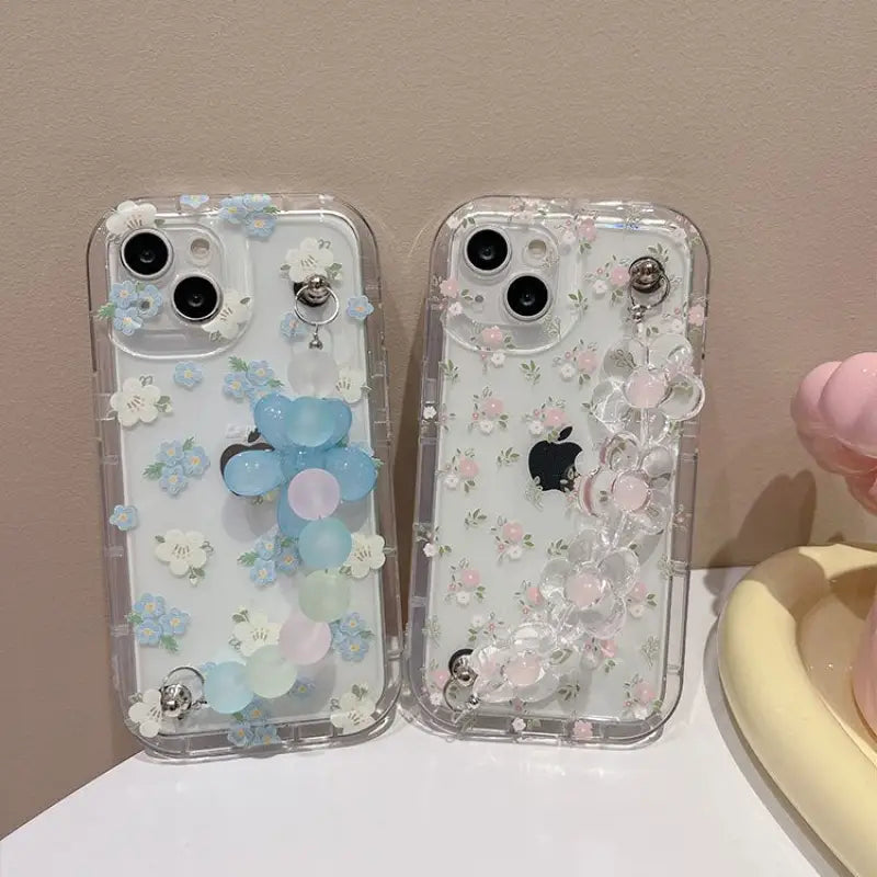 Two cases with flowers and butterflies on them