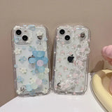 Two cases with flowers and butterflies on them