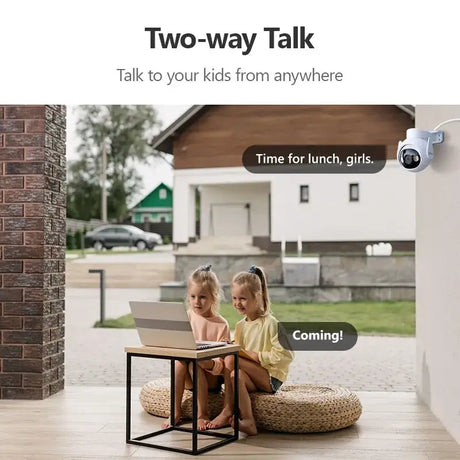 Two children sitting on a floor with a laptop