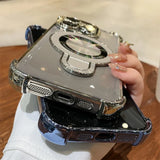 Two chrome-trimmed phone cases with ring stands.