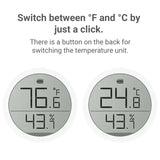 two clocks showing different times and temperatures on a white background