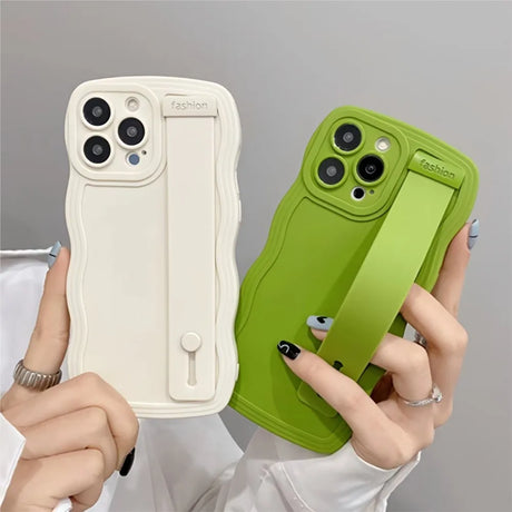 Two colorful phone cases with wrist straps.