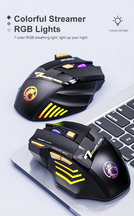 two computer mice sitting on top of a keyboard