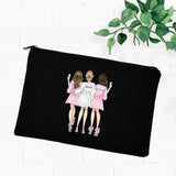 two girls in pink dresses are hugging on a black canvas pouch bag