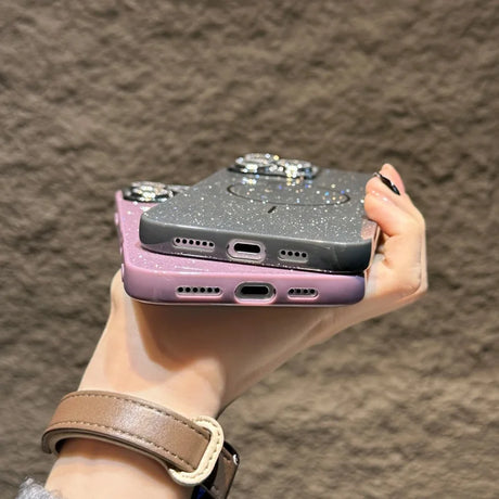 Two glittery phone cases.