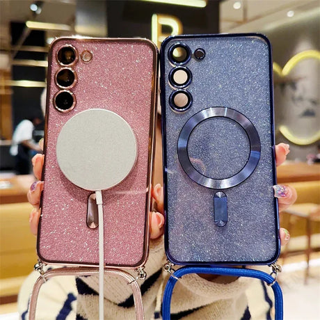 Two glittery smartphone cases with magnetic charging rings and camera cutouts, one in pink and one in blue.