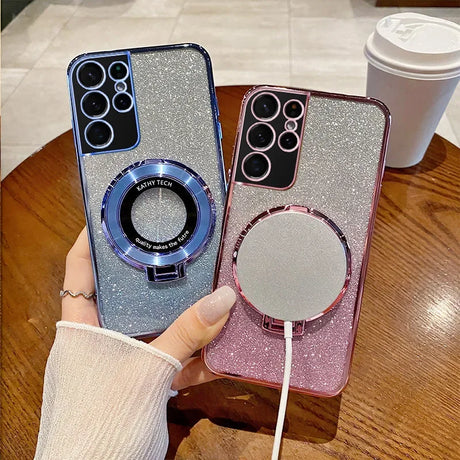 Two glittery smartphone cases with multiple camera lenses and circular magnetic charging attachments.