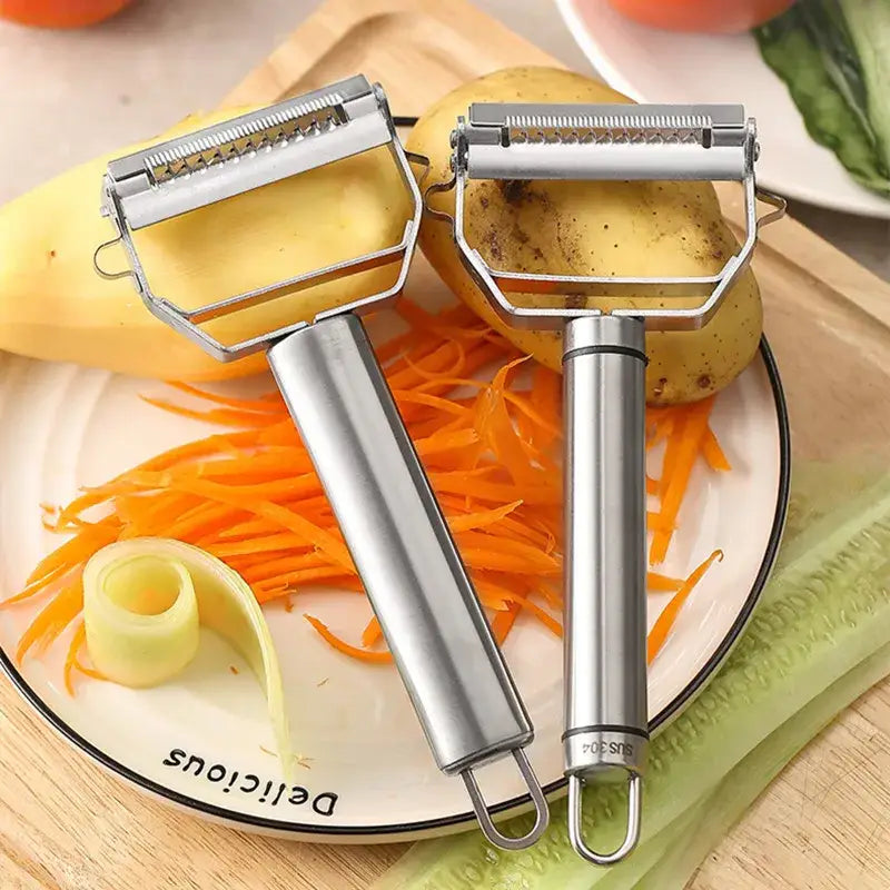 there are two graters on a plate with carrots and potatoes