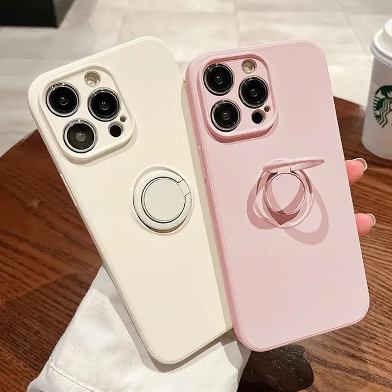 two iphone cases with a cup of coffee and a cup of coffee