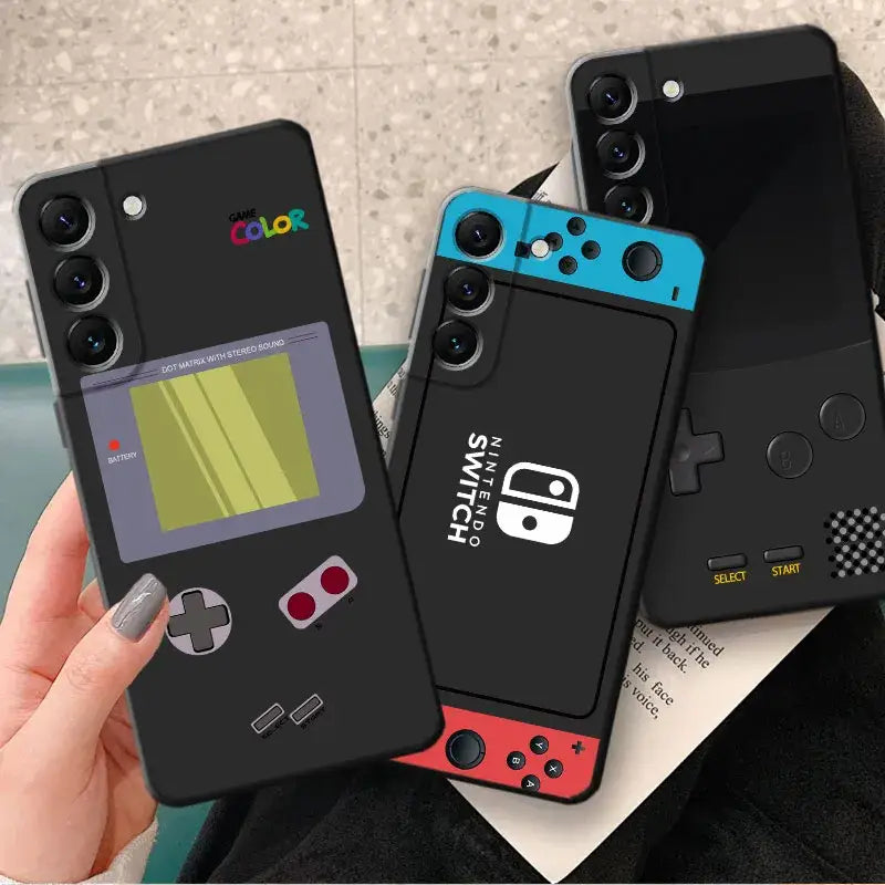 two iphone cases with a game boy on them