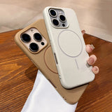 Two iPhone cases, one light beige and one off-white, both with built-in MagSafe rings and camera cutouts.